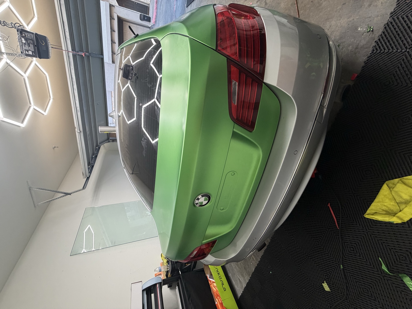 Satin green color change wrap on a BMW by Detailz Plugg